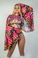 Stylish festival outfit featuring a colorful butterfly print and fishnet stockings for Bonnaroo vibes.