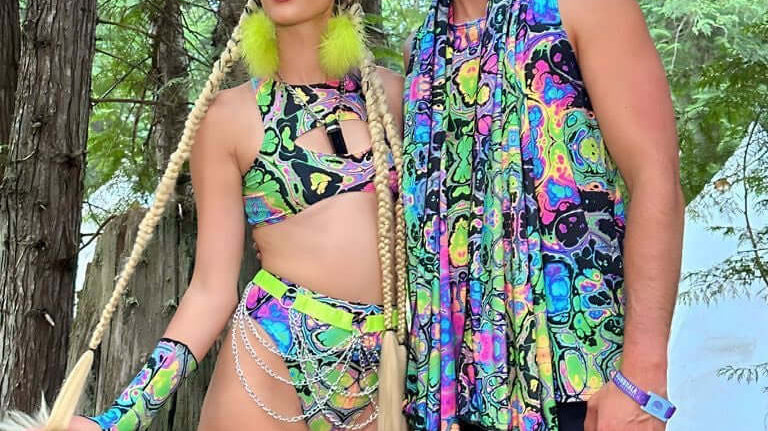 Shambhala 2024 attendees in vibrant, eco-friendly rave outfits from Freedom Rave Wear, made from recycled materials in San Diego