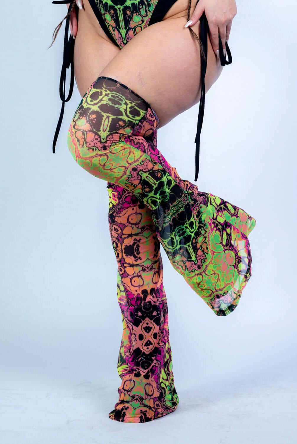 Intensity Cross Faded Bodysuit Set featuring vibrant UV-reactive prints and stylish leg sleeves for rave outfits.