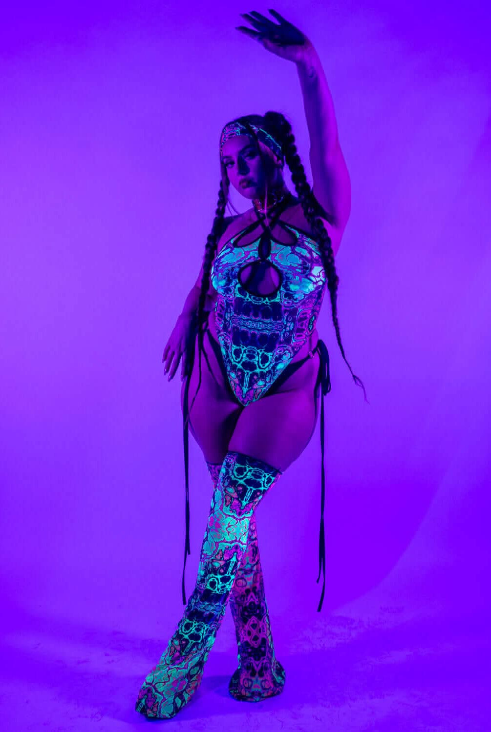 Intensity Cross Faded Bodysuit Set worn with vivid UV-reactive colors, perfect for rave outfits.