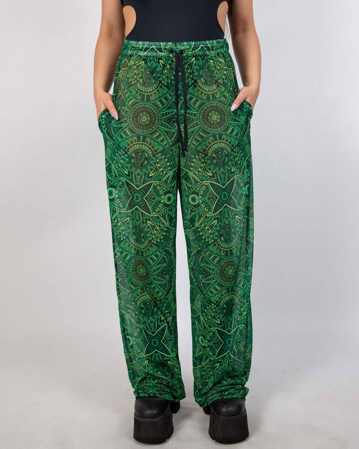 Dominion Mesh Lucy Pants in neon green tribal print, featuring pockets and a wide leg for rave style.
