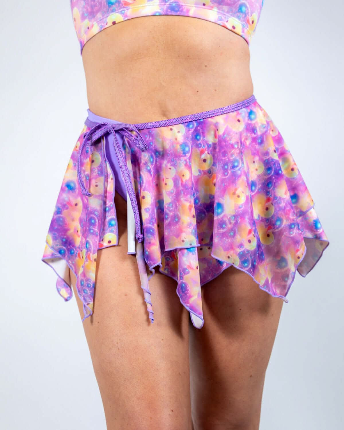 Duckies Fairy Skirt featuring a whimsical purple, yellow, and pink mesh design, perfect for rave outfits.