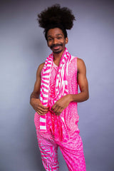 A man wearing a pink and white tank top with matching pants, with a matching pashmina draped over his shoulders.