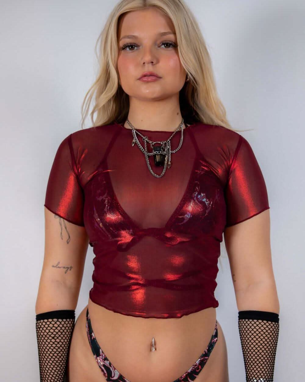 Front view of the Heartbreaker Mesh Baby Tee showing the high neckline, red mesh fabric, and merrow hem