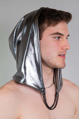 A photo of a man wearing a silver hood and no shirt.