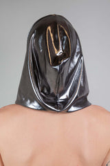 A photo of a man wearing a silver hood facing away from the camera.