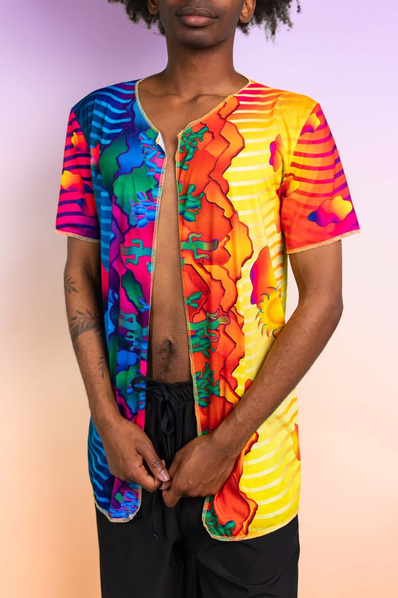 Colorful Freedom Rave Wear open-front tee in vibrant, flowing patterns ideal for a festival look, emphasizing a laid-back yet bold style