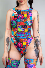 An up close photo of a girl wearing a rainbow patchwork bodysuit.