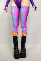 A woman's legs, dressed in leg sleeves with a neon synthwave design in blue and pink. The sleeves go up to her upper thigh.