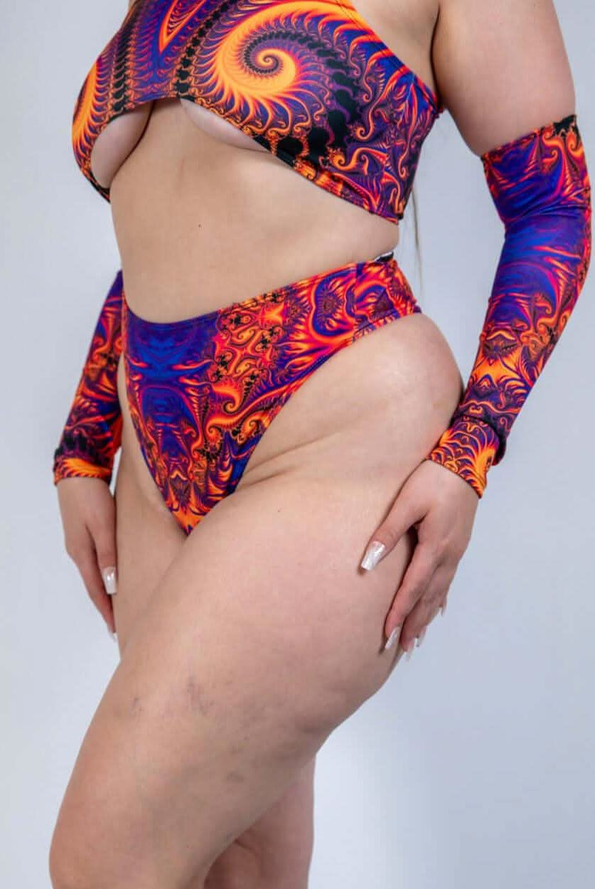 Radiance High Waisted Thong in vibrant cosmic colors, perfect for rave outfits and showcasing curves on the dance floor.