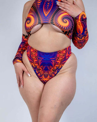 Model wearing a vibrant orange, violet, and pink high waisted thong with matching top, perfect for rave outfits.