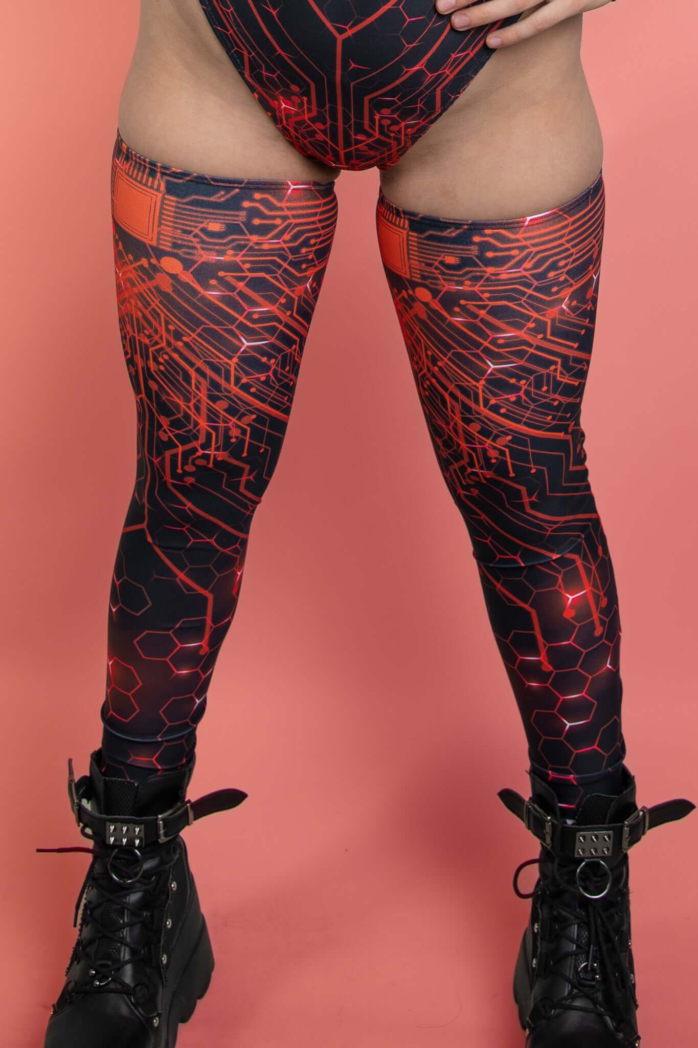 Freedom Rave Wear circuit print leggings, paired with heavy boots, merge high-tech style with comfort, perfect for the rave scene