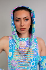 GPT Model wearing Freedom Rave Wear floral rave bodysuit with vibrant patterns, showcasing a cozy hood, accentuated with a bold, stylish necklace