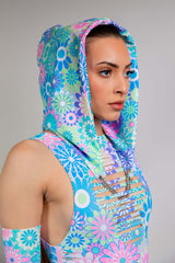 Model in Freedom Rave Wear's hooded floral bodysuit, showcasing vibrant patterns with a sleek hood, perfect for rave enthusiasts.