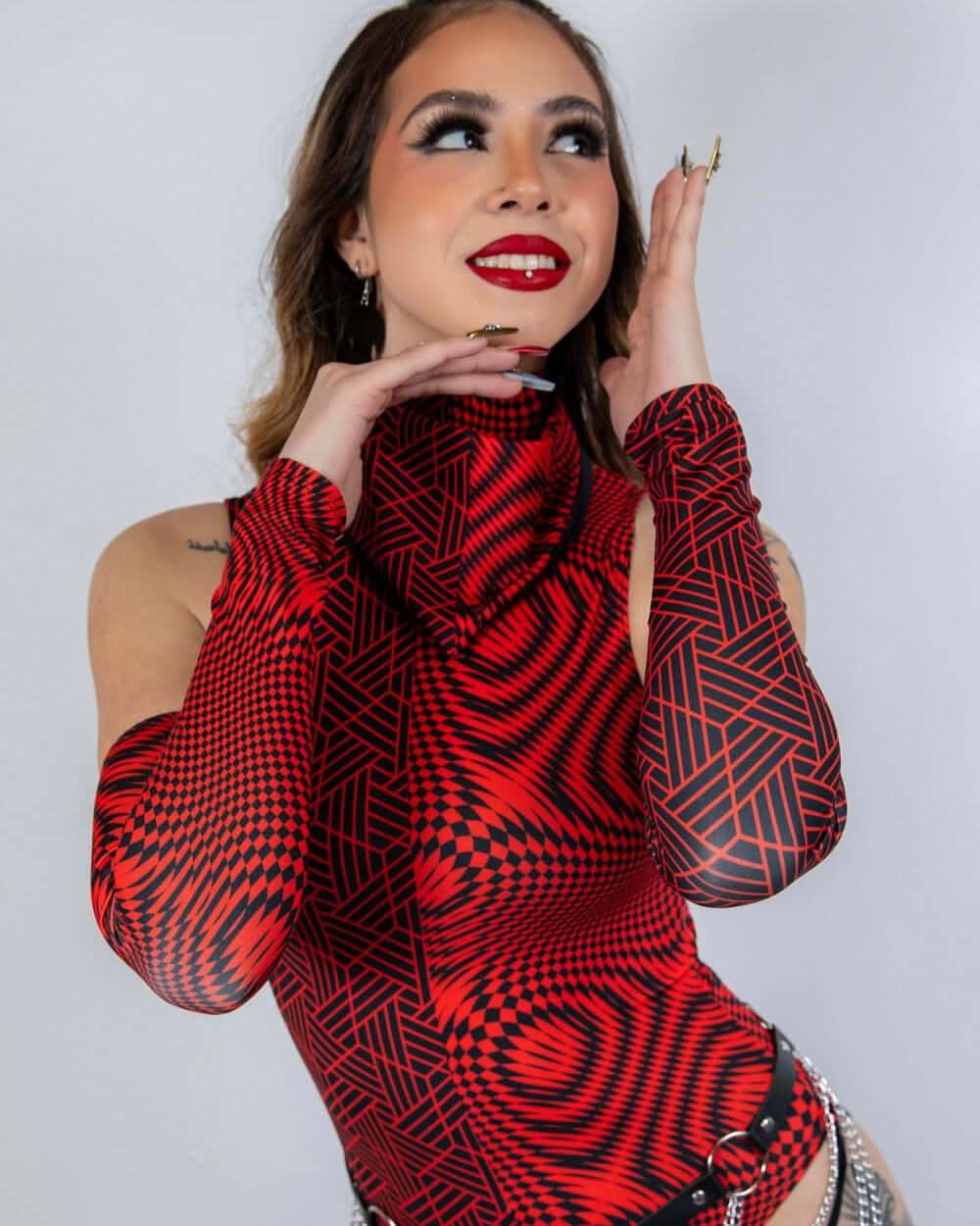 Model showcasing Amplitude Arm Sleeves in striking red and black design, perfect for rave outfits.
