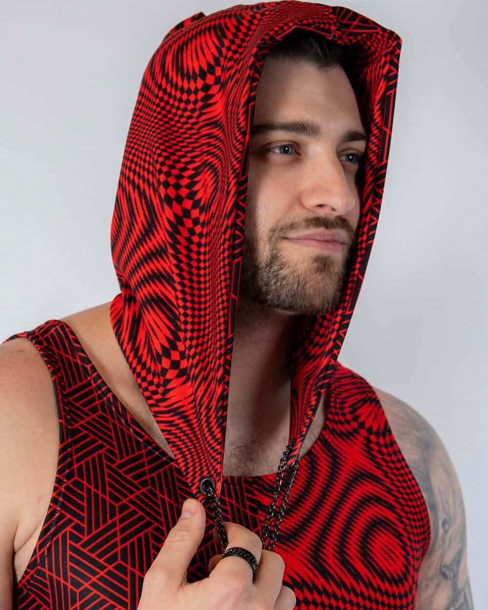 Model wearing the Amplitude Assassin Hood featuring a bold red and black design, perfect for rave outfits.