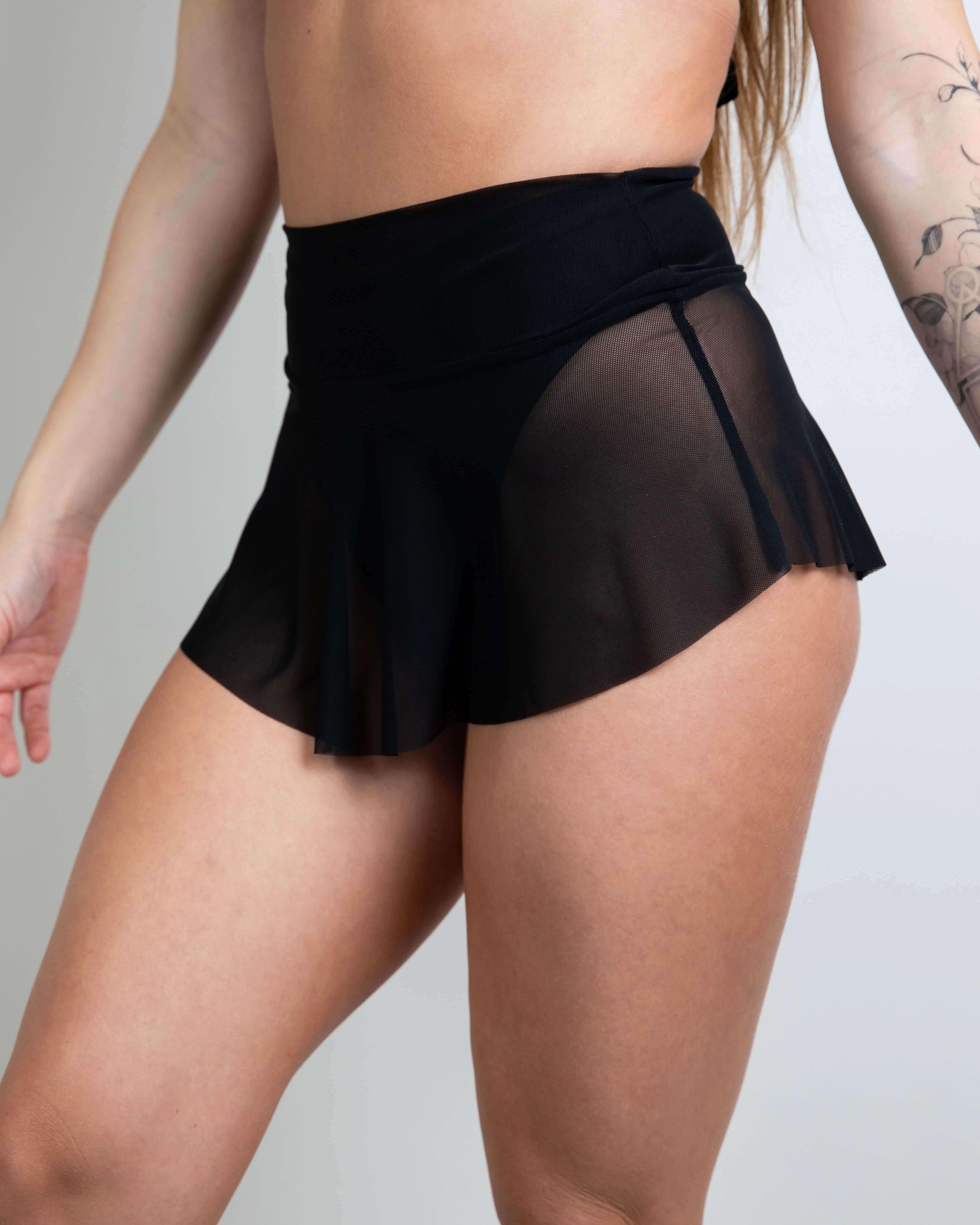 Black mesh micro skater skirt for rave outfits, designed for comfort and style on the dance floor. Lightweight and playful.