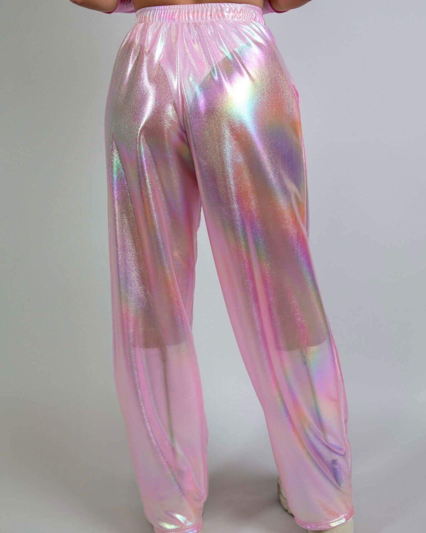 Iridescent pink bubble gum Lucy pants showcasing wide-leg design and comfortable fit, perfect for rave outfits.