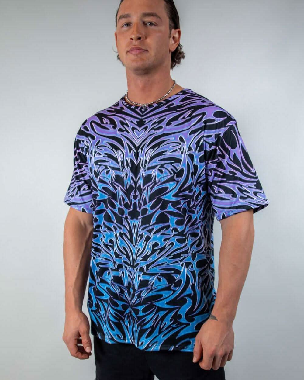 Model wearing the Chromium Oversized Softee, a cyber sigalism print T-shirt with a loose, comfortable fit.