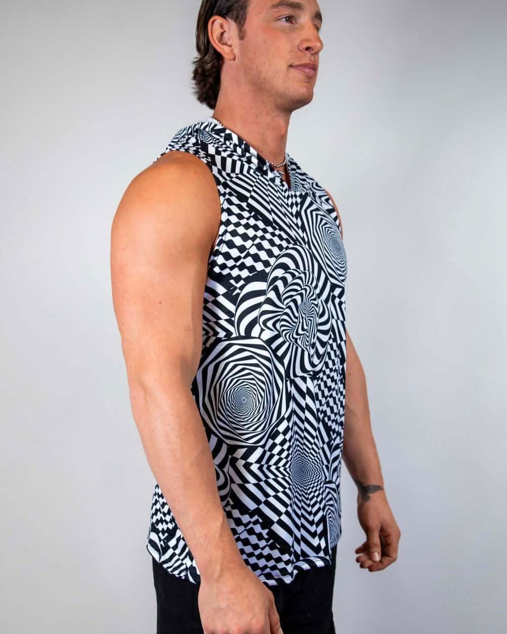 Man modeling a black and white Distortion Tank Top with Hood, showcasing an abstract optical design, ideal for rave outfits.