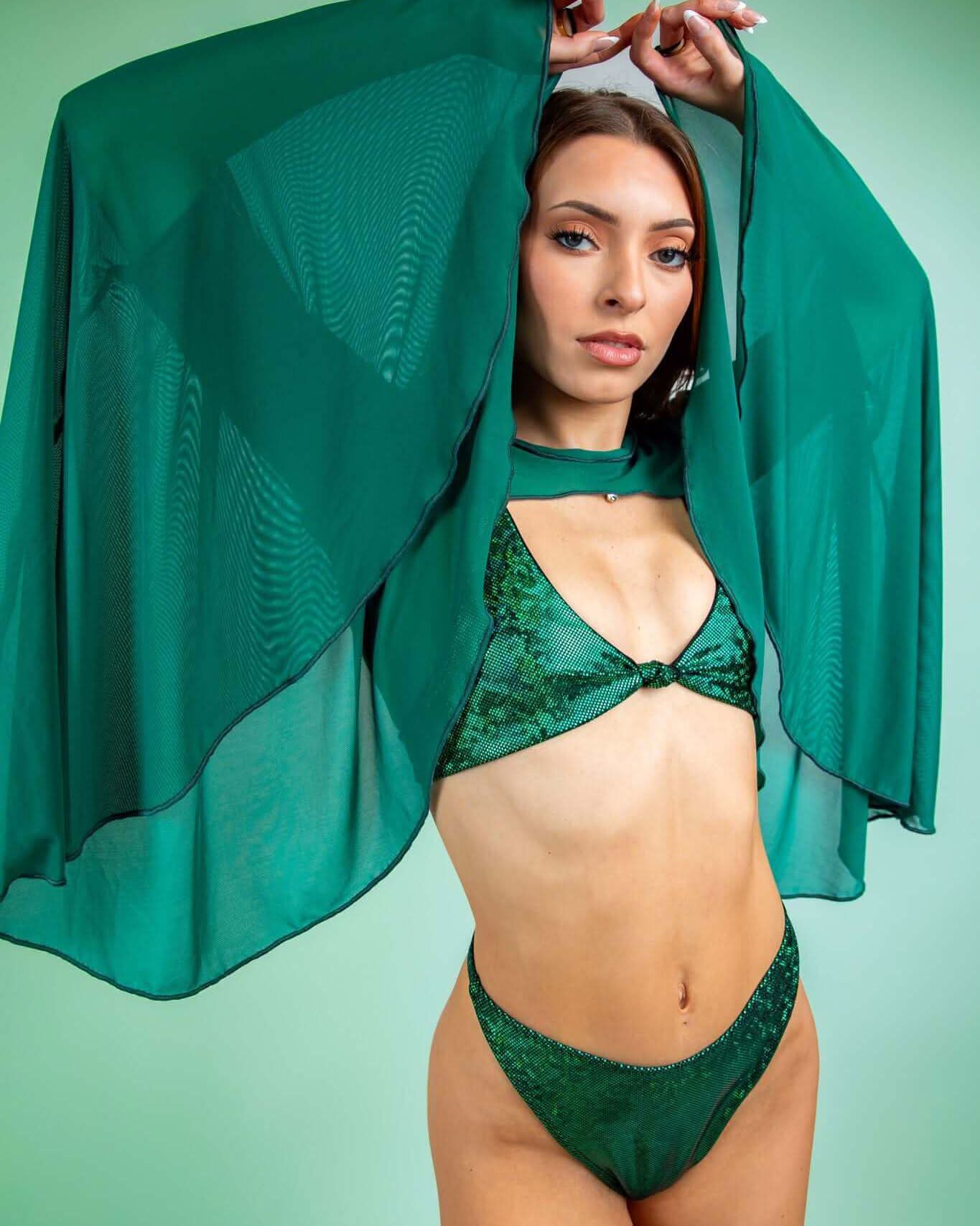Model showcasing emerald mesh bell sleeves over a matching bikini, perfect for rave outfits and stylish festival wear.