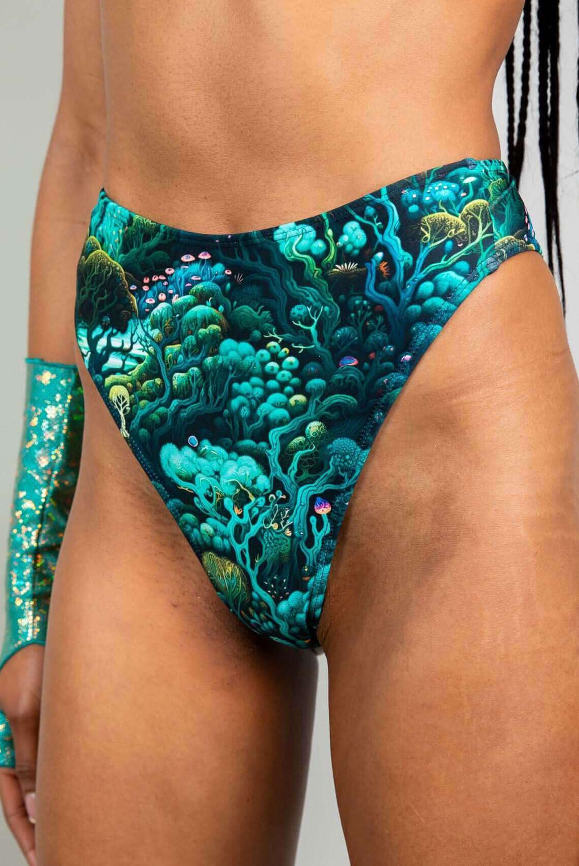 High-waisted thong featuring a vibrant forest pattern, perfect for rave outfits and eco-friendly fashion.