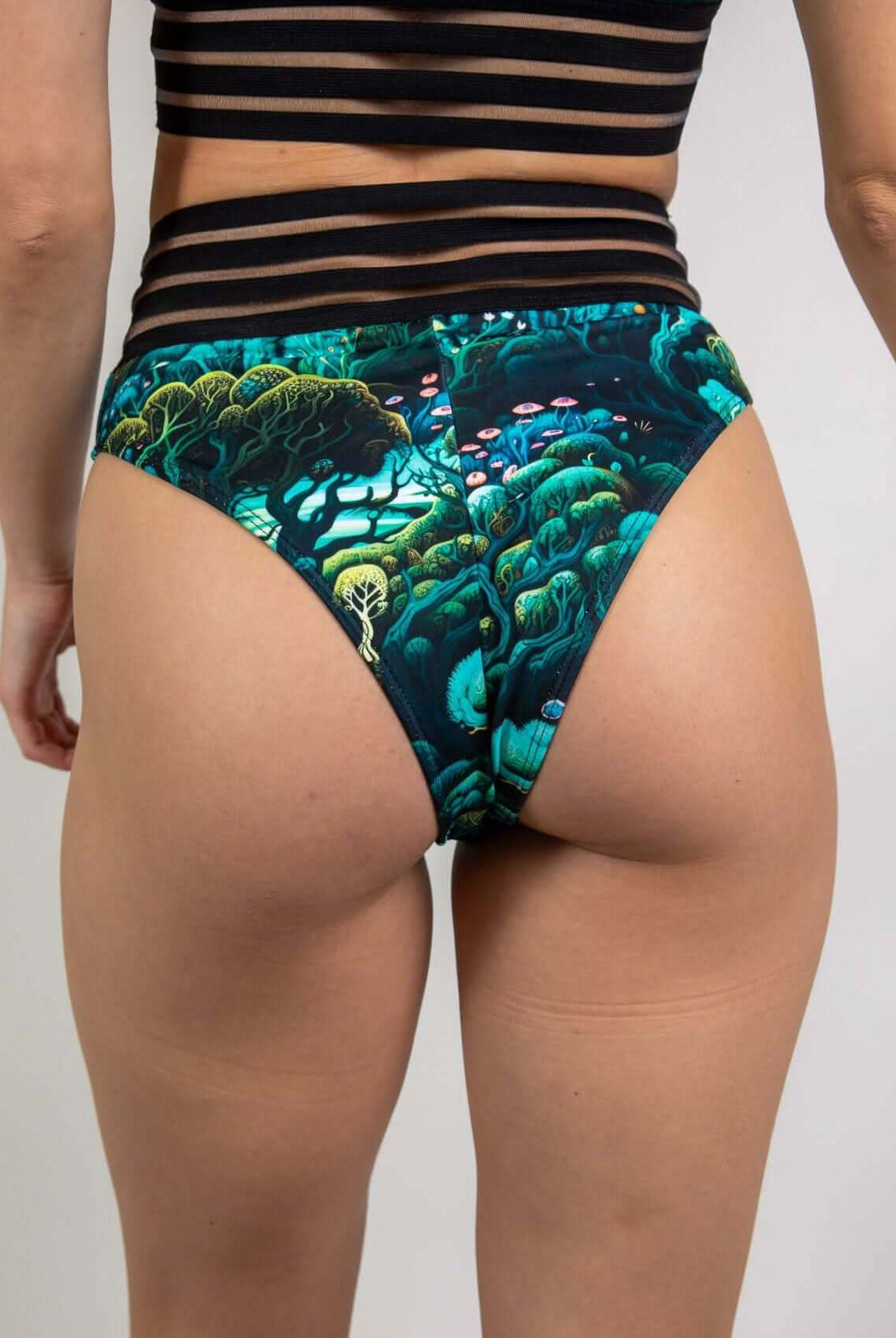 Female model showcasing Faewood Sporty Bottoms with Brazilian cheeky cut, perfect for rave outfits and festival wear.