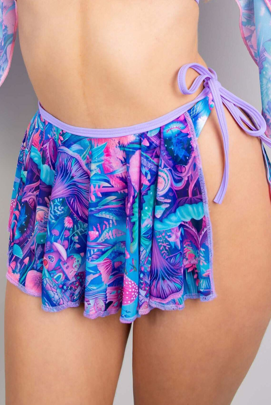 Vibrant fairycore mesh swirl skirt with tropical print, perfect for rave outfits and stylish layering options.