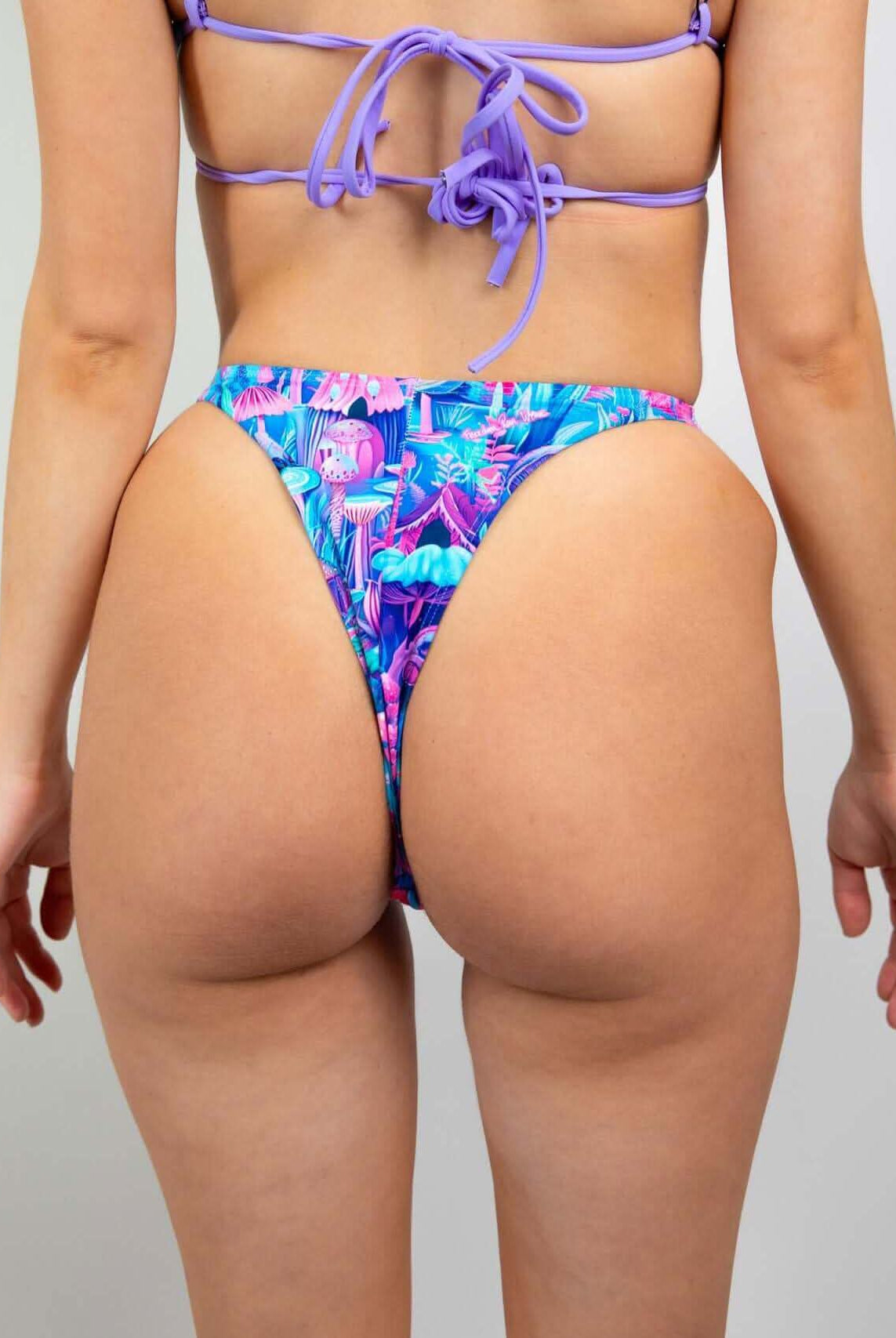 Fairycore Retro Thong Bottoms in vibrant blue and pink with a whimsical mushroom pattern, perfect for rave outfits.