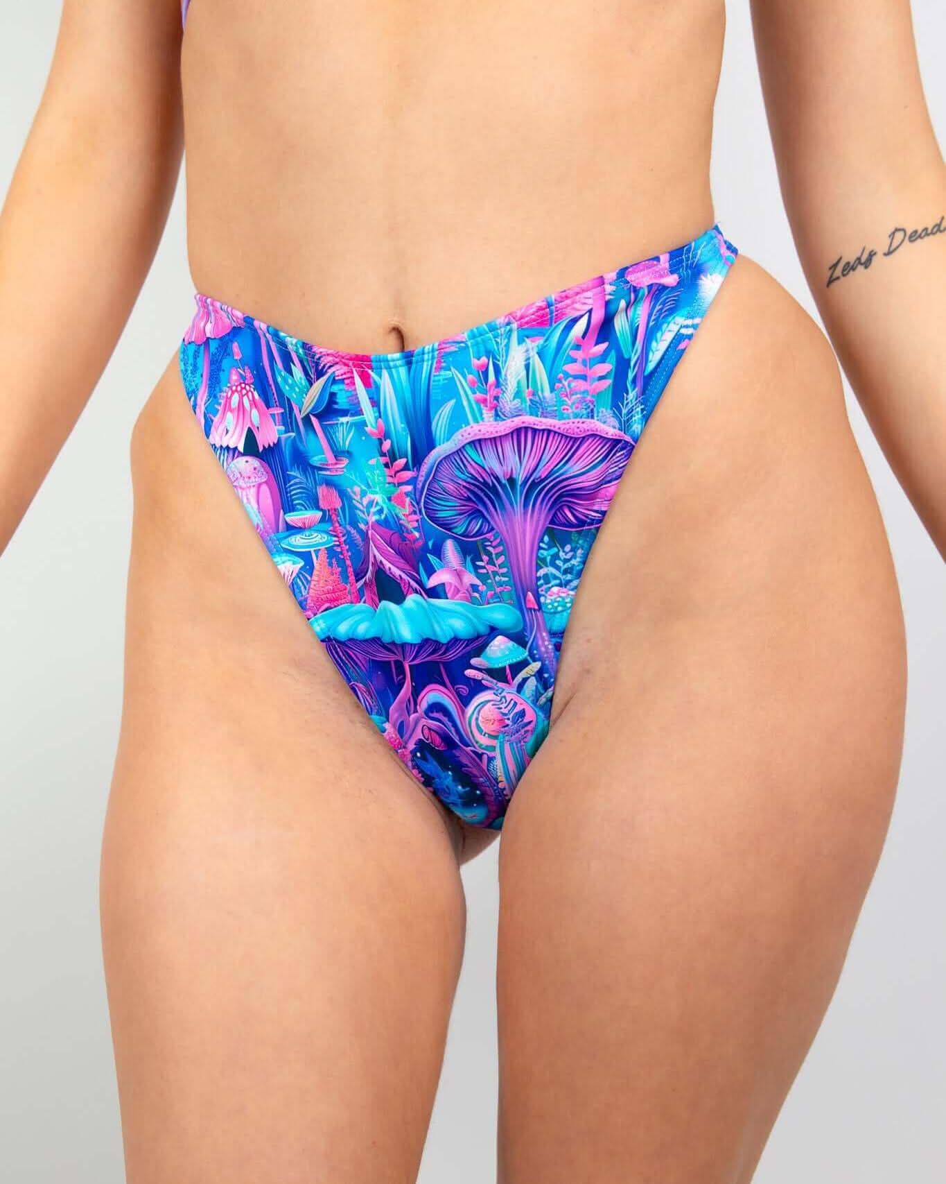 Fairycore Retro Thong Bottoms featuring a vibrant mushroom print in blue, pink, and purple, perfect for rave outfits.