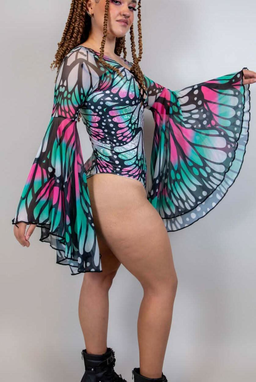 Model wearing Flutter Goddess Bodysuit with butterfly print and bell sleeves, showcasing a stunning rave outfit.