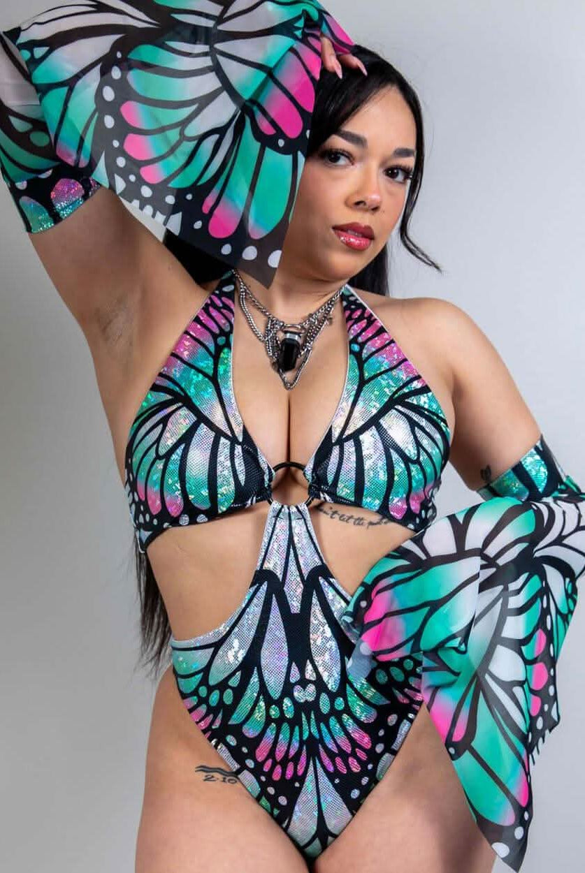 Model showcasing Flutter Metamorphosis Sleeves with a butterfly pattern, perfect for rave outfits and clothing.