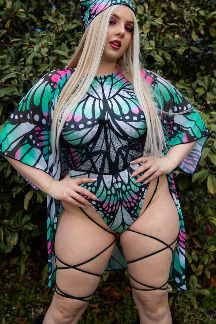Model showcasing Flutter Sideboob Bodysuit with leg straps and butterfly print, perfect for rave outfits and clothing.