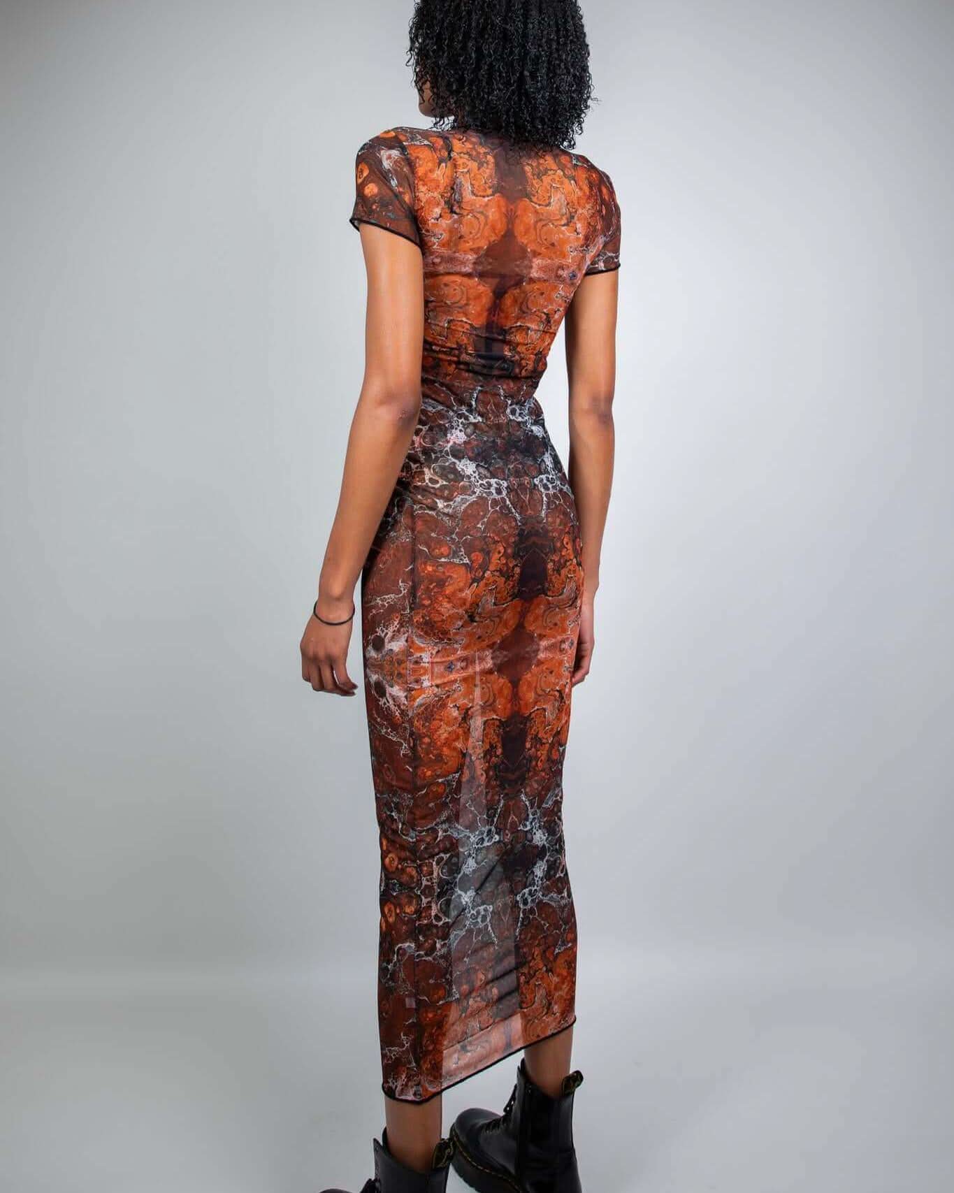 Model showcasing Fossil Mesh Baby Tee Maxi Dress, a stylish and breathable outfit perfect for raves or nightclubs.