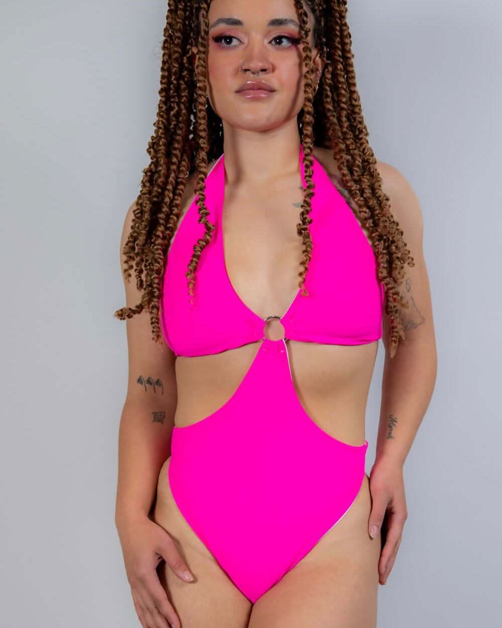 Full-body front view of the Hot Pink O-Ring Bodysuit, emphasizing its bold cut and eye-catching festival look.