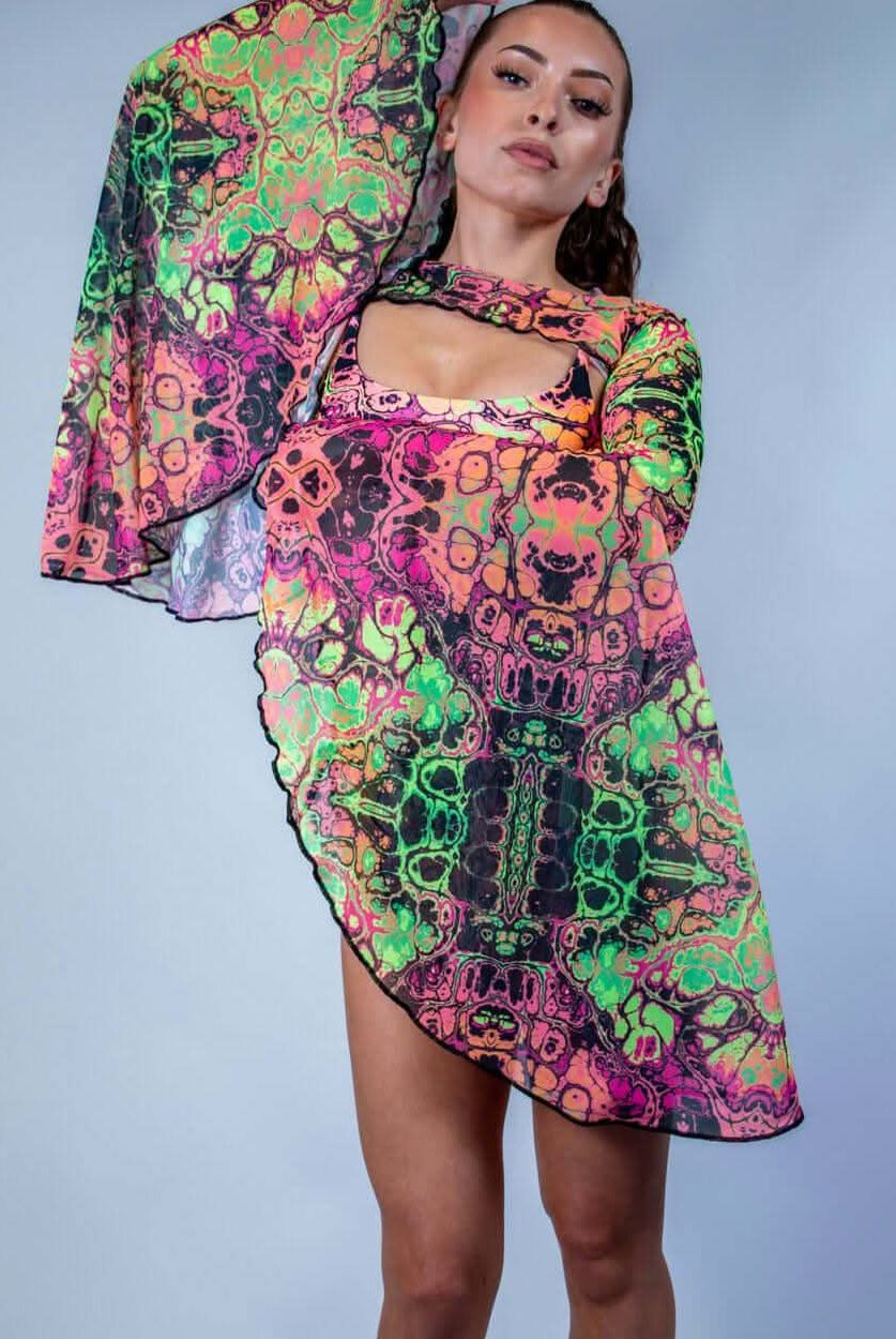 Model showcasing vibrant Intensity Mesh Bell Sleeves, perfect for stylish rave outfits with flowy design.
