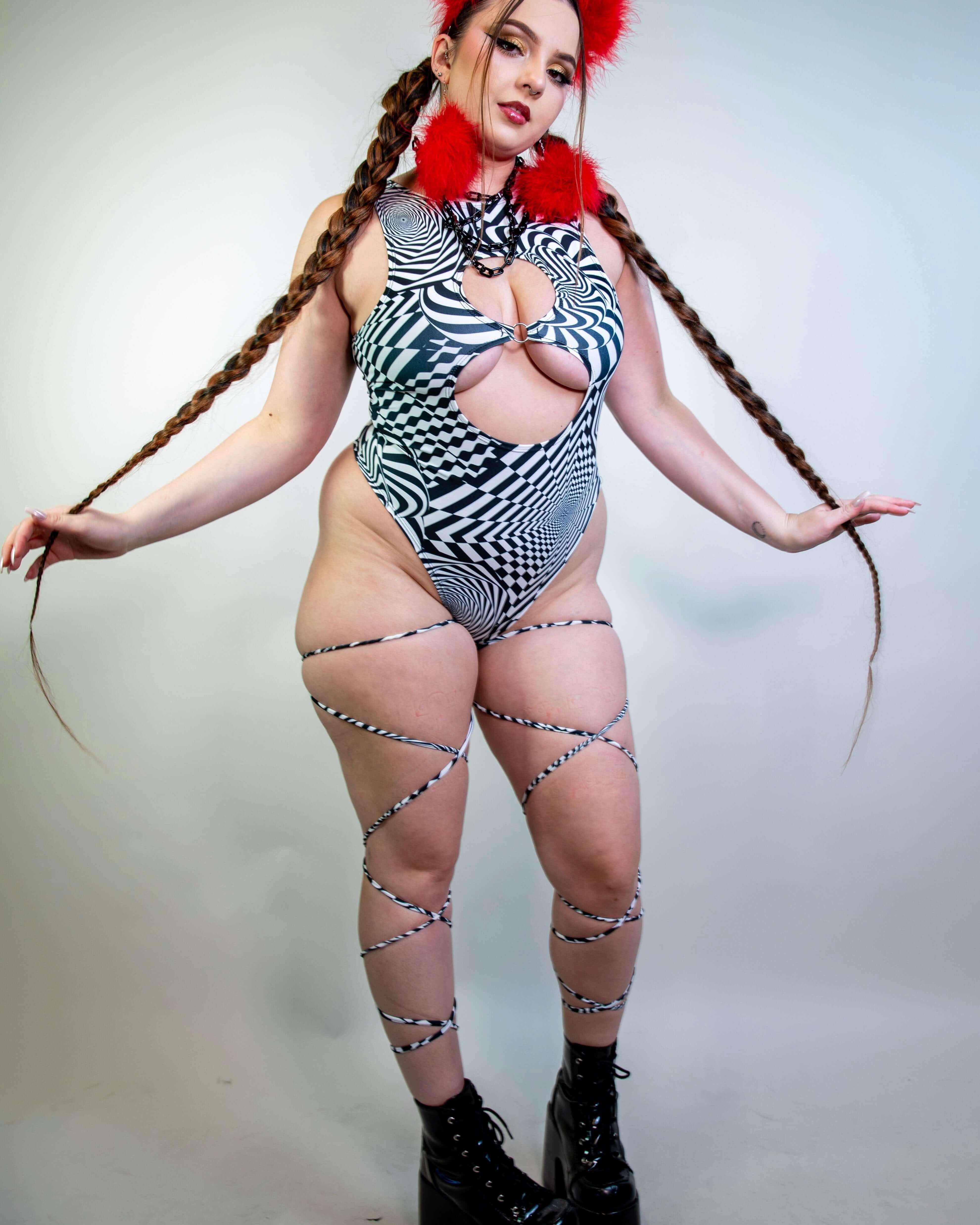 Model styling the Distortion Leg Wraps with a matching outfit, highlighting their edgy rave-ready appeal.