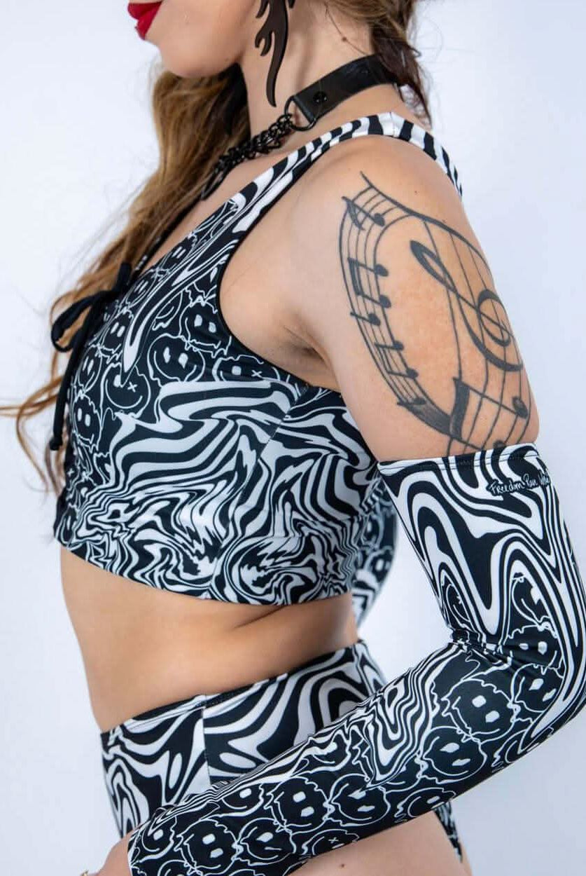 Side profile of the Meltdown Lace Up Top, showing the fit and design details with a focus on the sleeve and lace-up front.