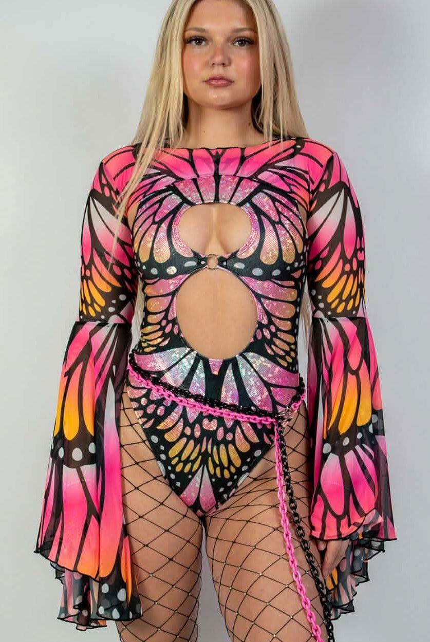 Model wearing a Monarch Keyhole Bodysuit in neon pink and orange butterfly design, perfect for rave outfits.