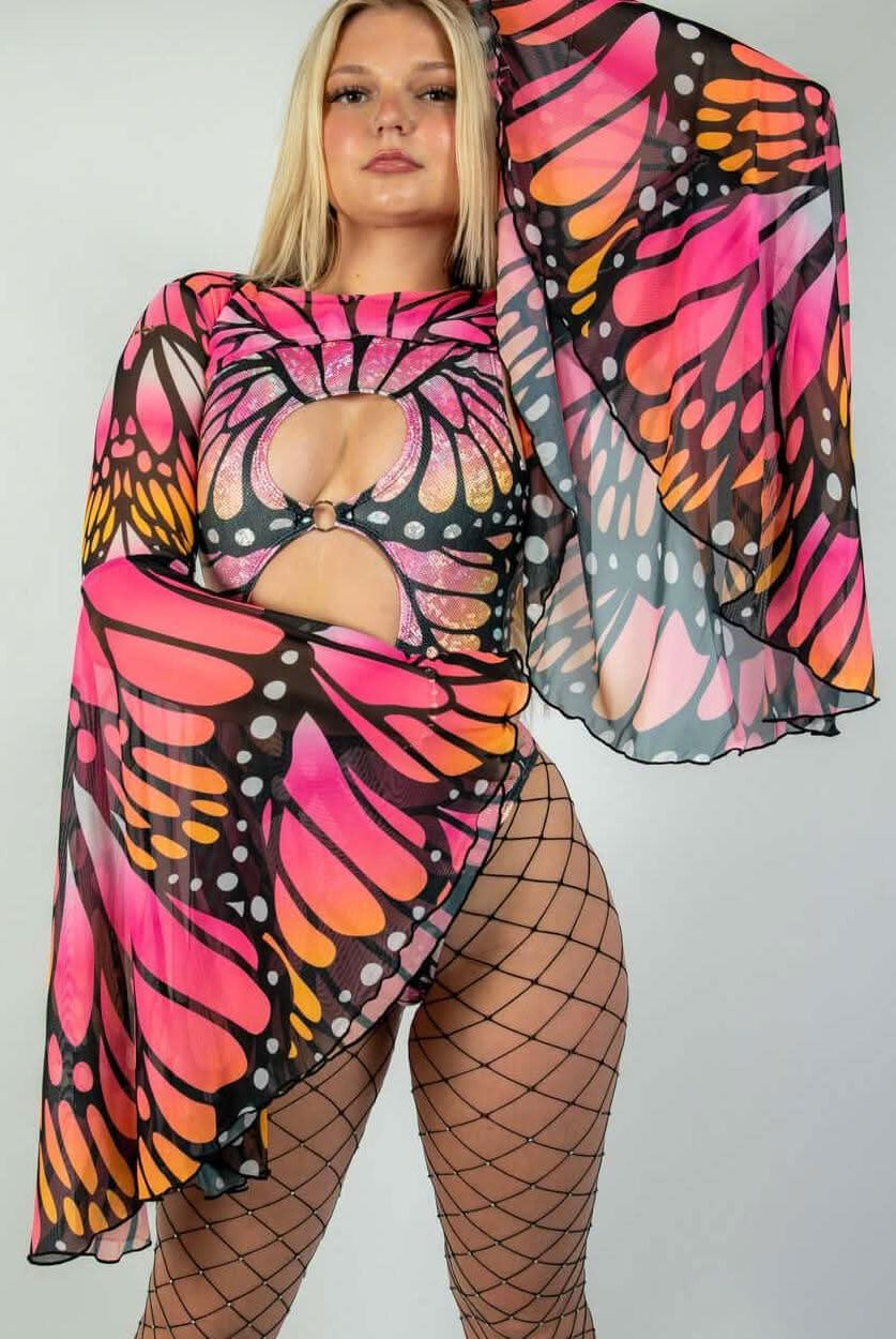 Model wearing vibrant Monarch Mesh Bell Sleeves with butterfly print, styled for rave outfits and eye-catching appeal.