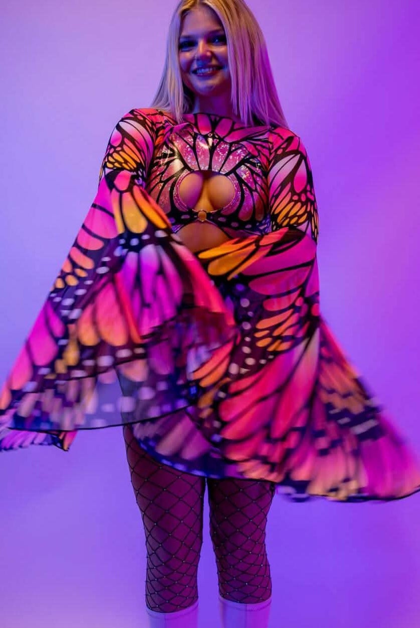 Model wearing vibrant Monarch Mesh Bell Sleeves, showcasing a colorful butterfly design, perfect for rave outfits.