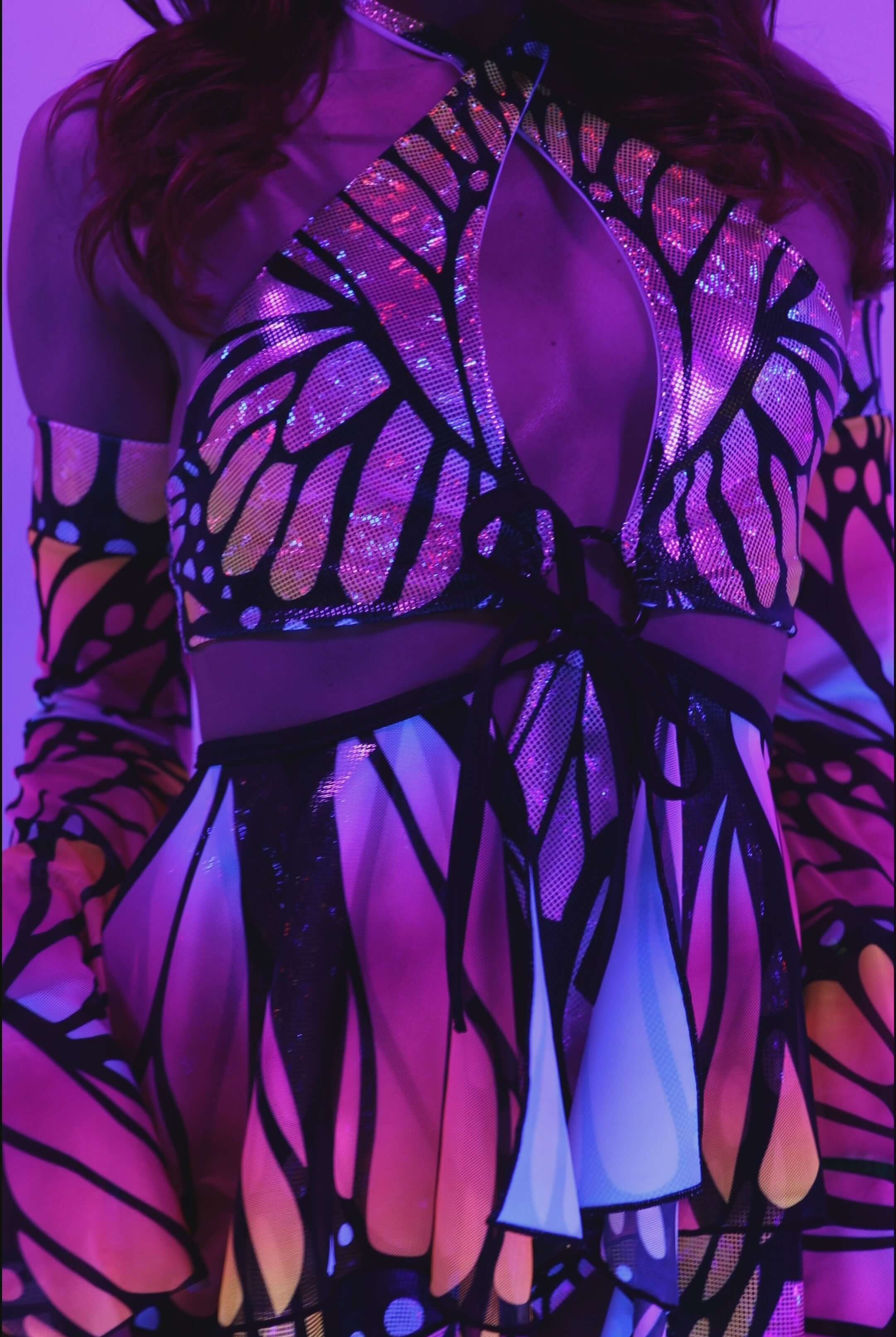 Monarch O-Ring Bodysuit with colorful butterfly design, perfect for rave outfits and versatile rave clothing.
