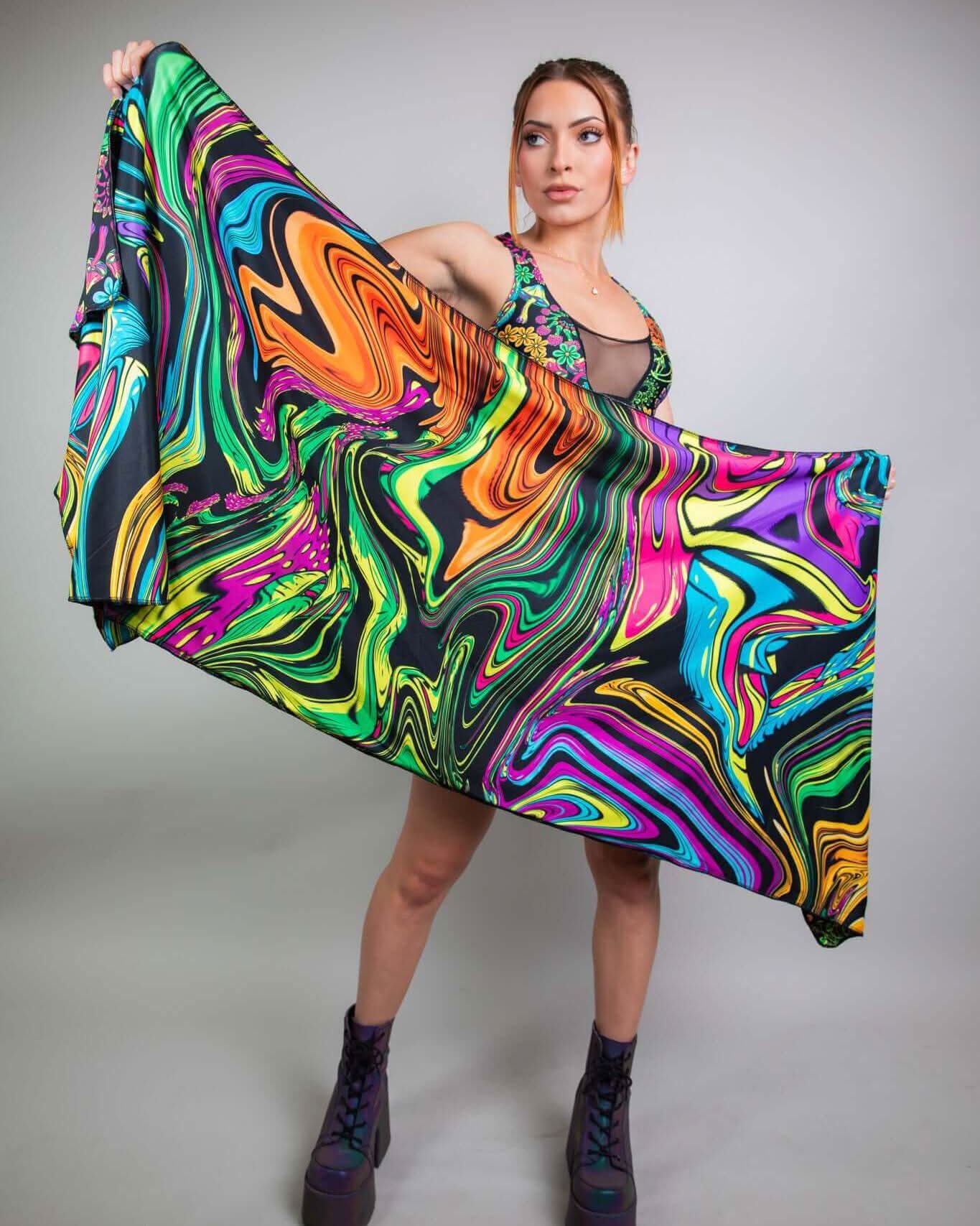 Model showcasing the vibrant PsyBloom Festival Scarf, featuring psychedelic swirls, perfect for rave outfits.