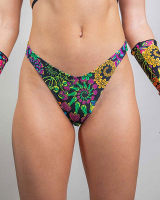 PsyBloom psychedelic thong bottoms with vibrant floral print, perfect for rave outfits and standing out in the crowd.