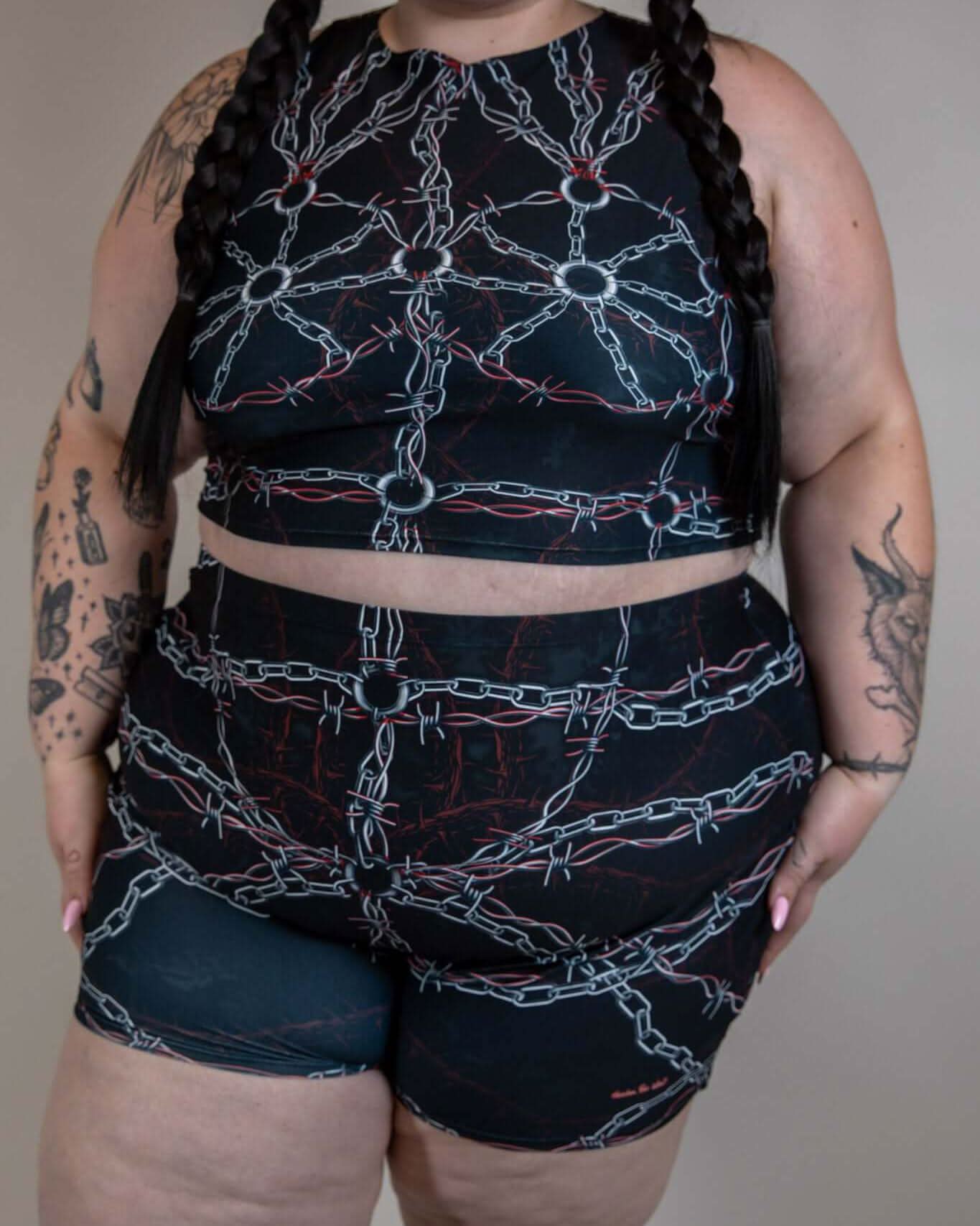 Model wearing the Purgatory Crop Top with chain design, perfect for rave outfits and festival fashion.