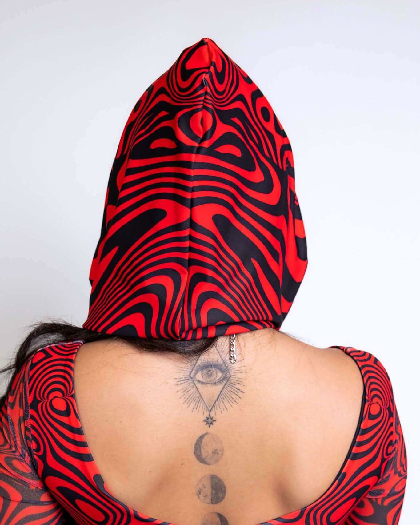 Vibrant red and black Red Void Assassin Hood styled for rave outfits, showcasing a unique design and a striking look.