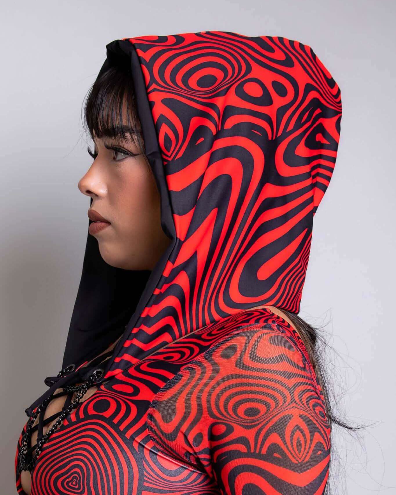 Side view of a model wearing a vibrant red Void Assassin Hood, perfect for rave outfits and cyberpunk style.