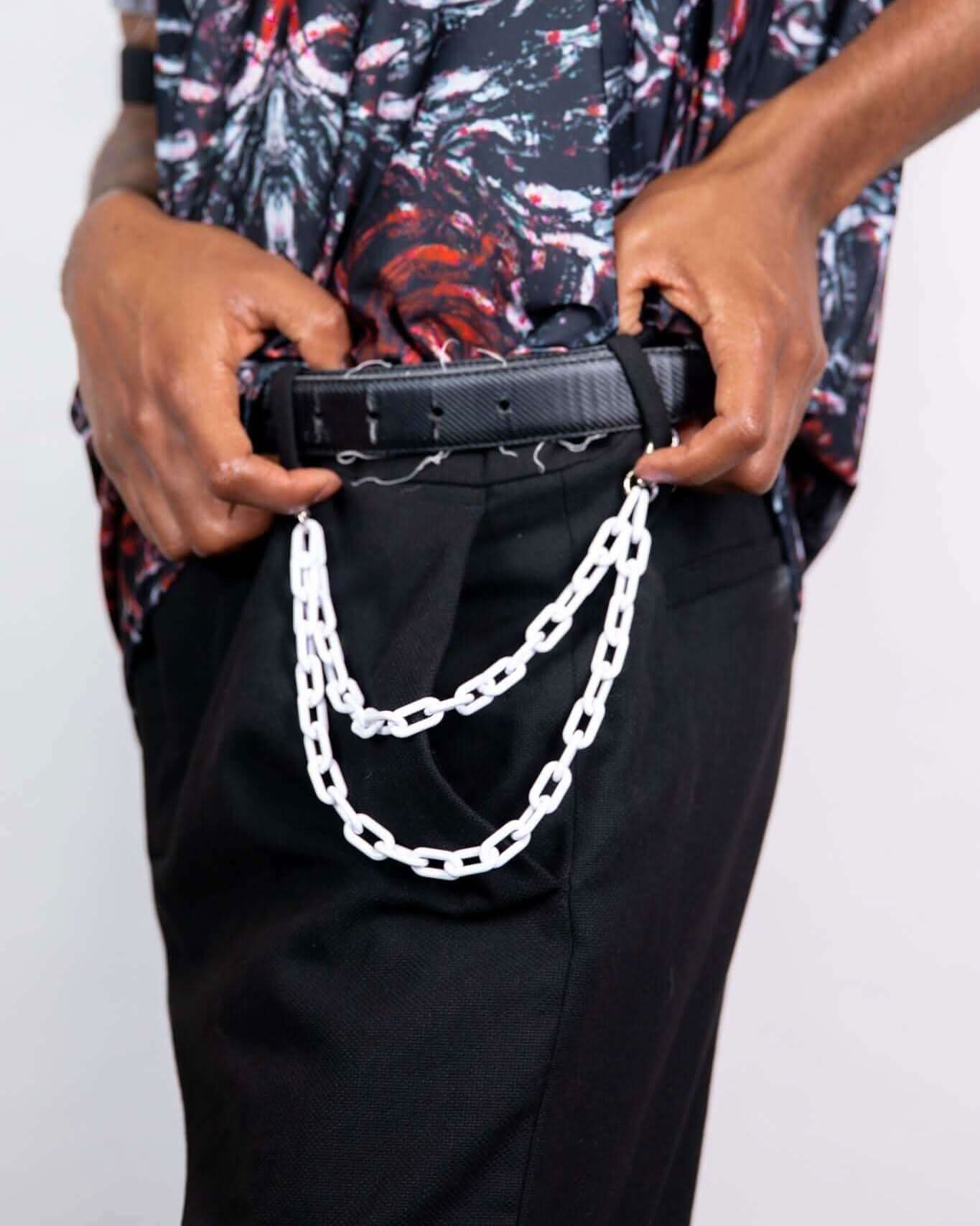 Model showcasing Charmer Chain belt attached to stylish black pants, perfect for rave outfits and festivals.
