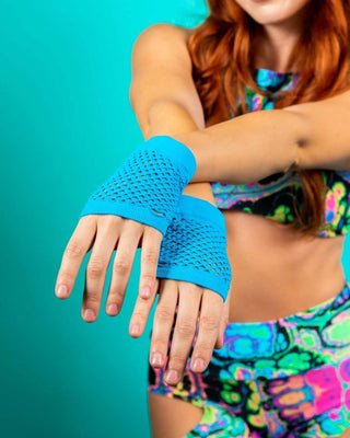 Turquoise fishnet gloves on a model, perfect accessory for rave outfits and festivals, showcasing soft and stretchy material.