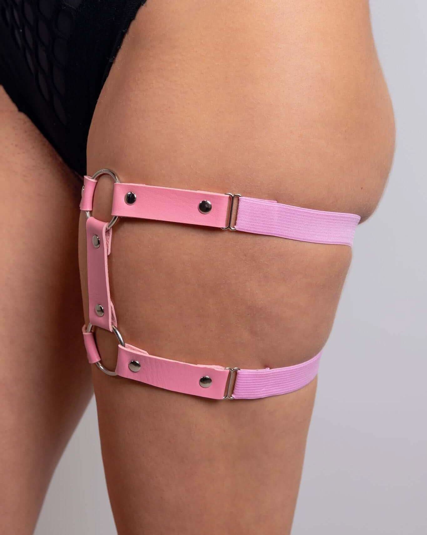 Leather adjustable leg garter in light pink, perfect for rave outfits and edgy festival styles.